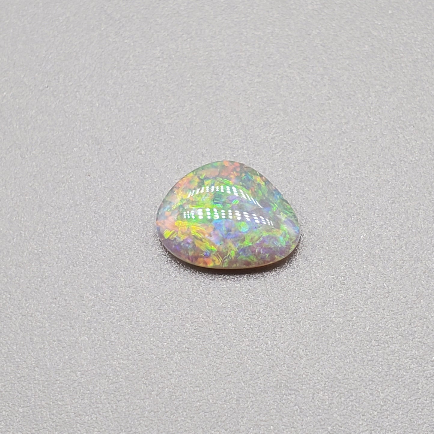 0.60cts Dark Opal with multi color palette and mixed pattern