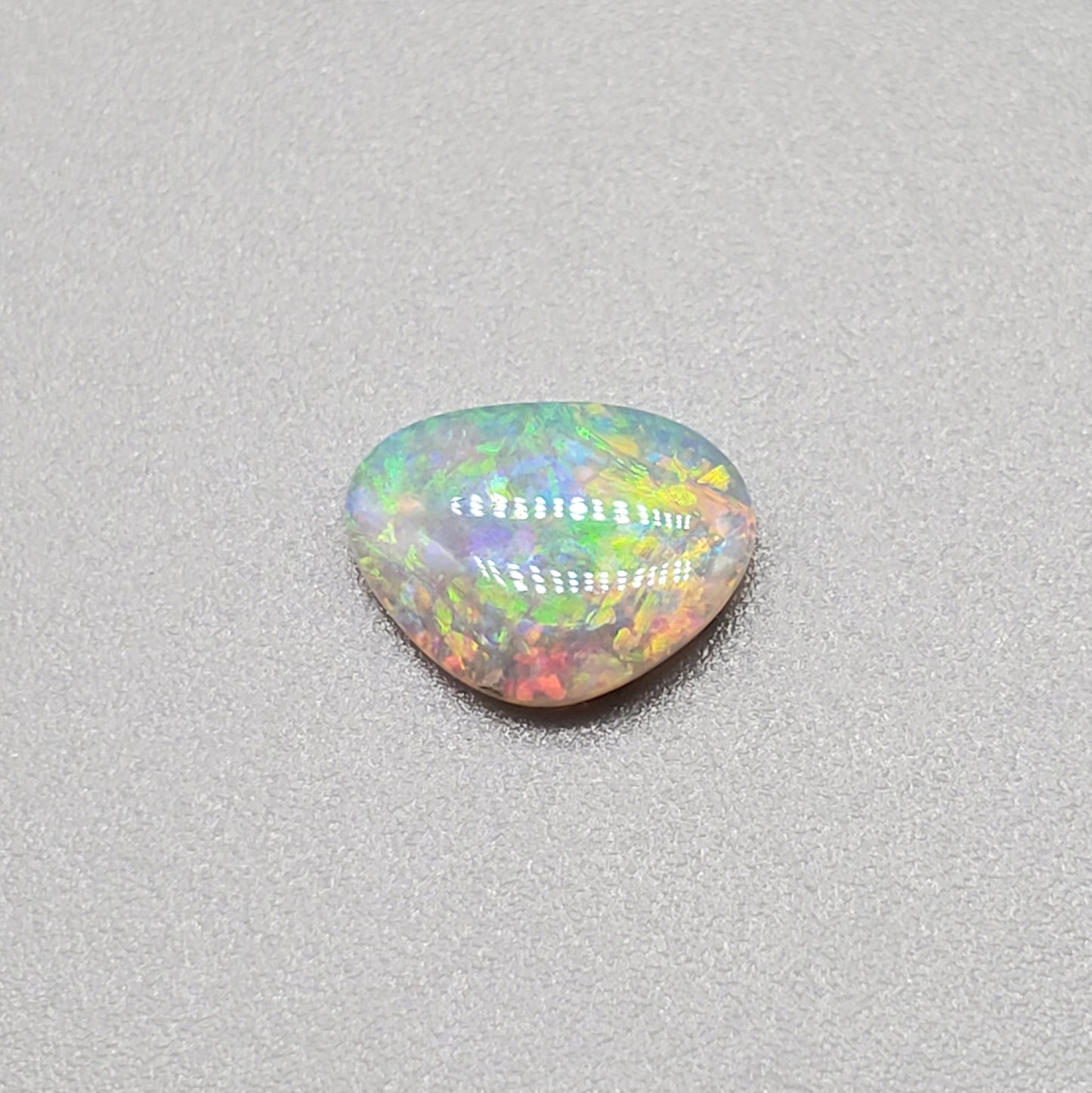 0.60cts Dark Opal with multi color palette and mixed pattern