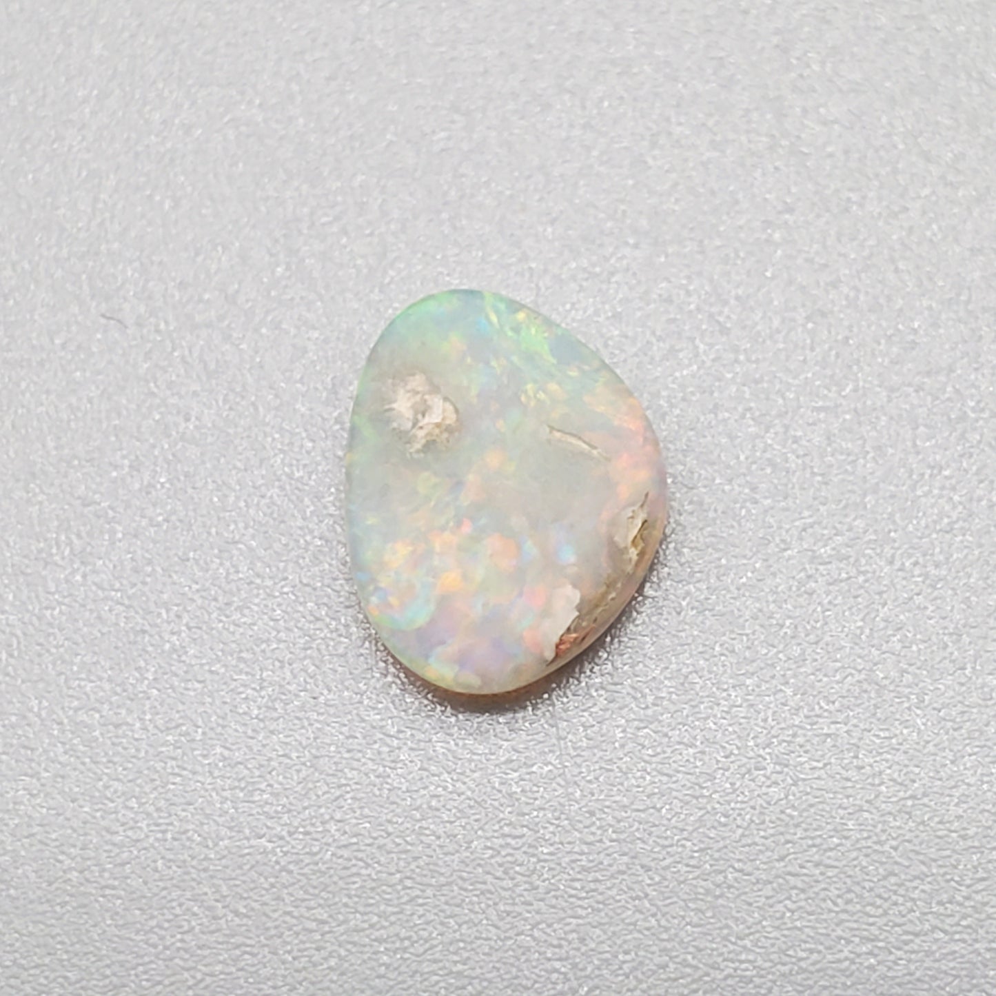 0.60cts Dark Opal with multi color palette and mixed pattern