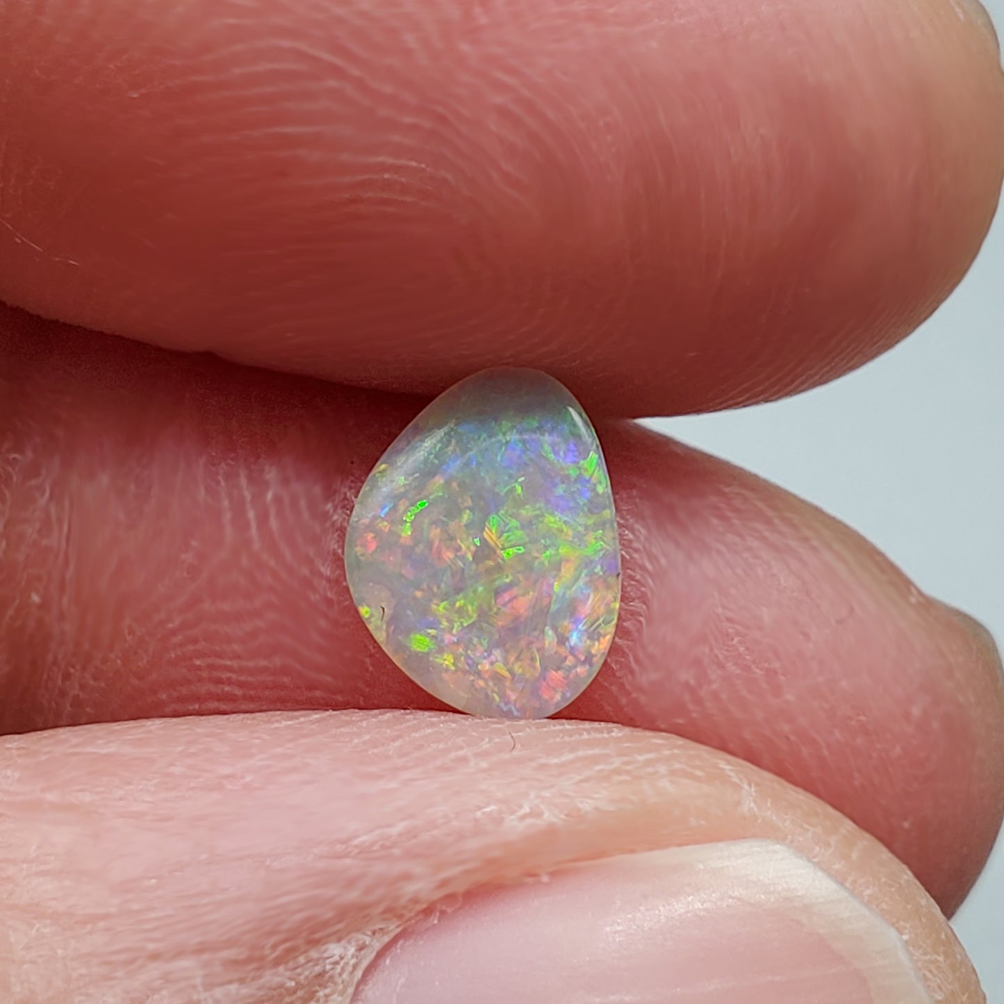 0.60cts Dark Opal with multi color palette and mixed pattern