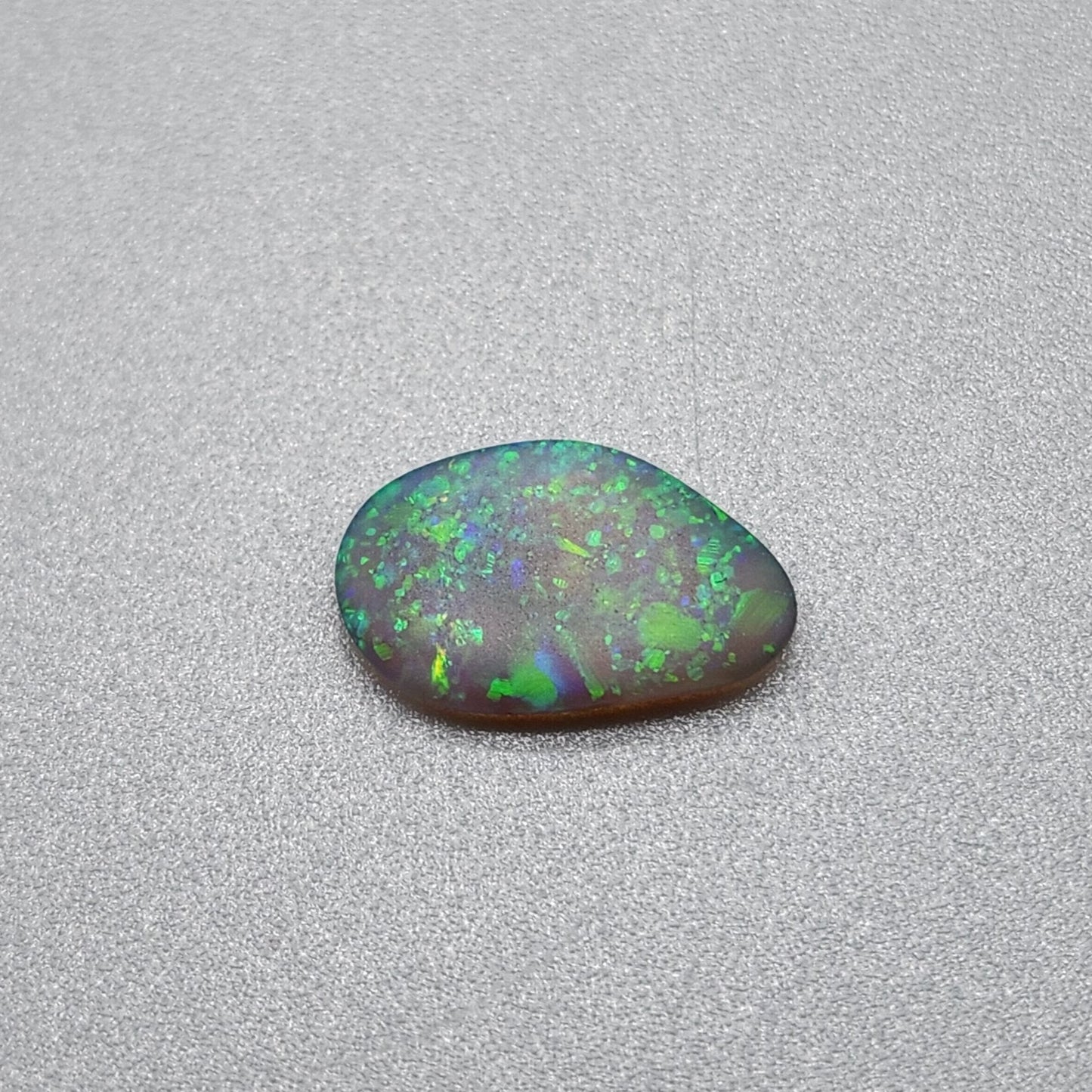 0.70cts  Matte dark Crystal Opal with lovely Green speckled pattern