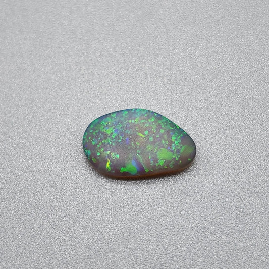 0.70cts  Matte dark Crystal Opal with lovely Green speckled pattern