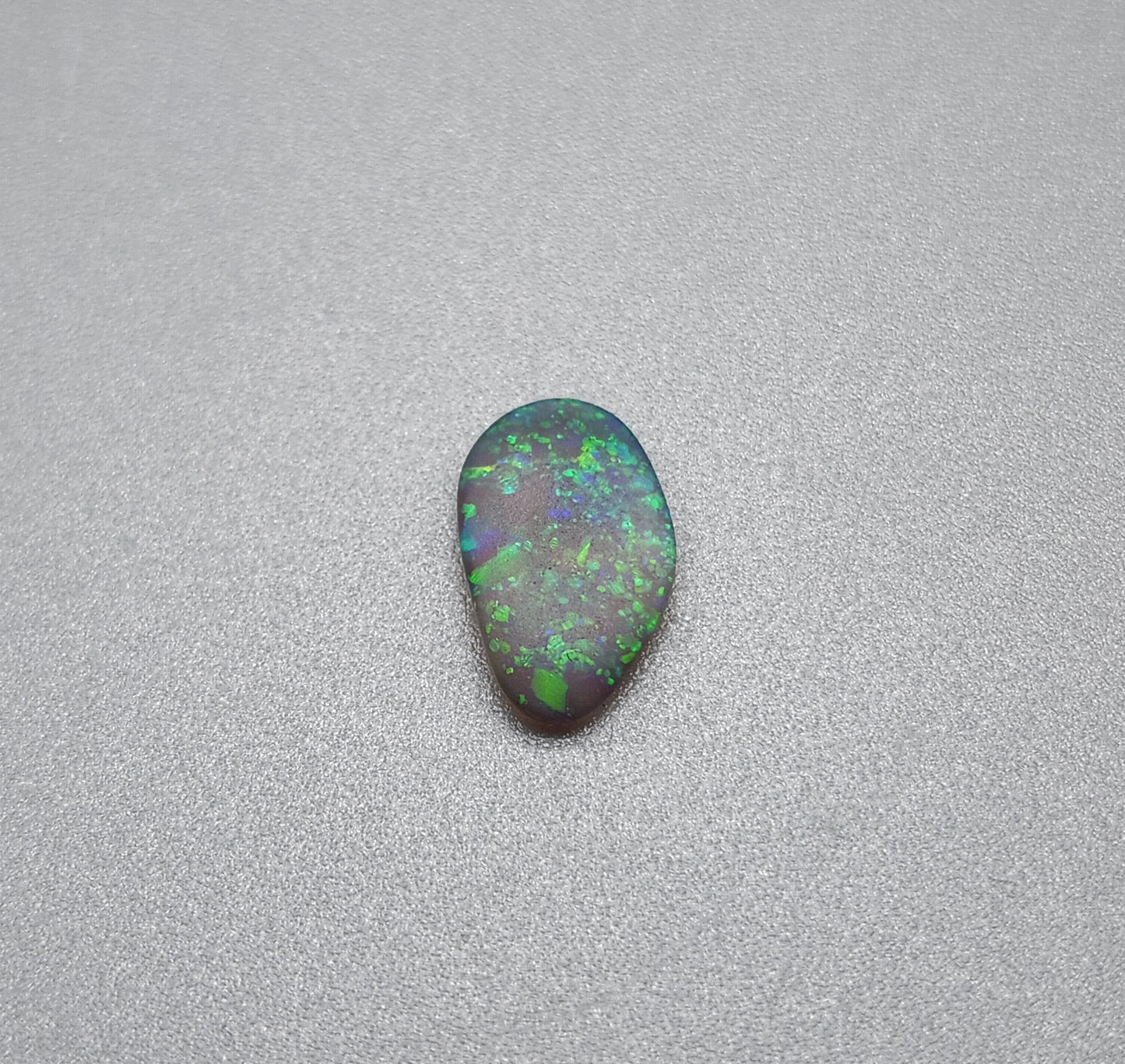 0.70cts  Matte dark Crystal Opal with lovely Green speckled pattern