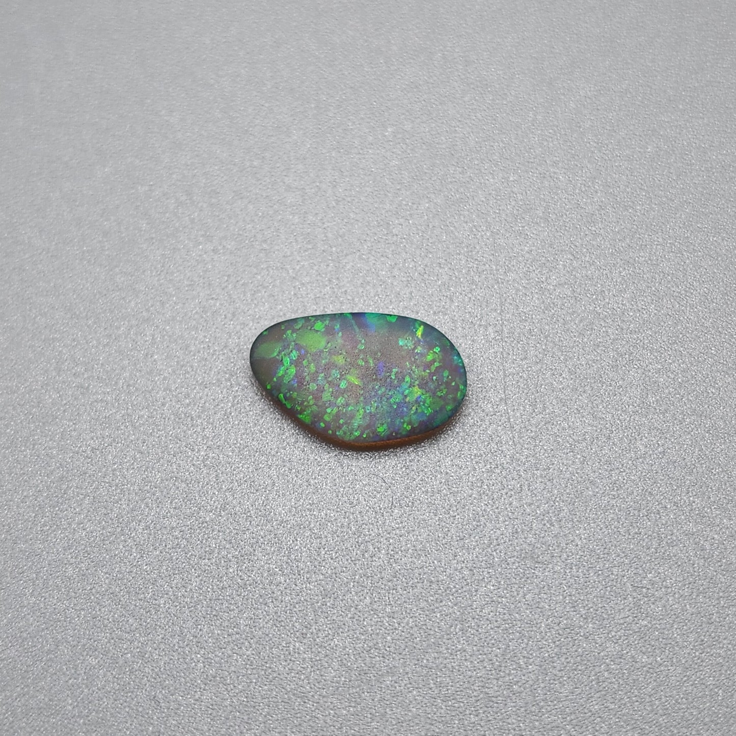 0.70cts  Matte dark Crystal Opal with lovely Green speckled pattern