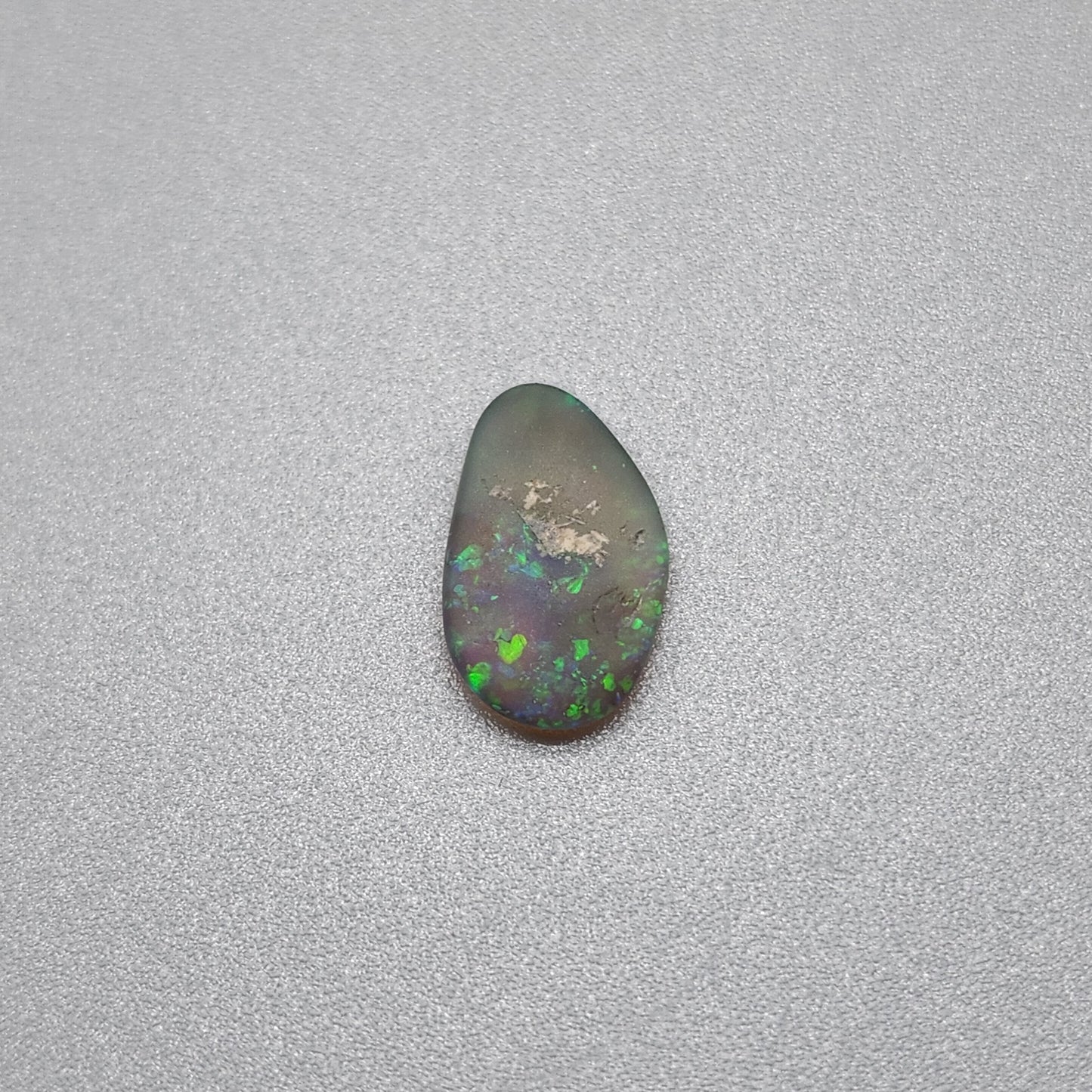 0.70cts  Matte dark Crystal Opal with lovely Green speckled pattern