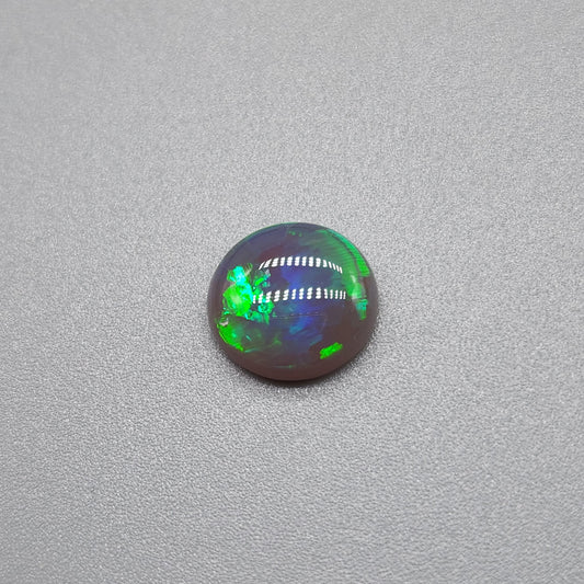 1.3cts Black opal with vivid green mixed pattern color play