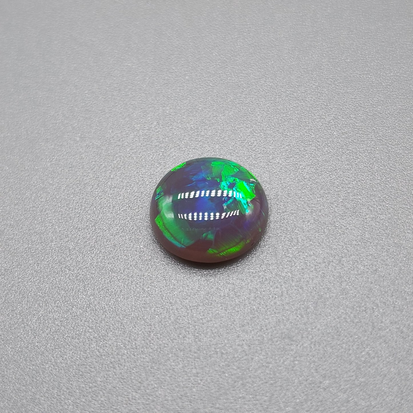 1.3cts Black opal with vivid green mixed pattern color play