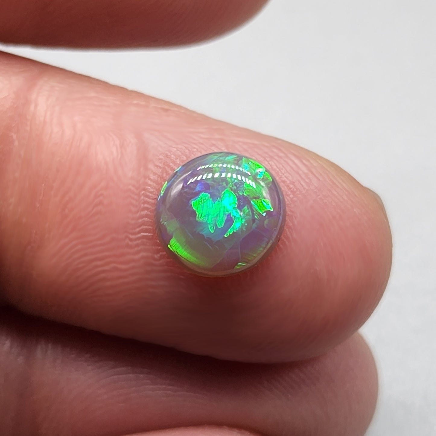 1.3cts Black opal with vivid green mixed pattern color play