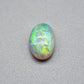 1.7cts Dark opal with a springtime pallet of yellows, greens and light blue