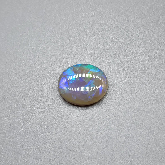 1.8cts Dark opal with blue green color play and blocky pattern with chaff