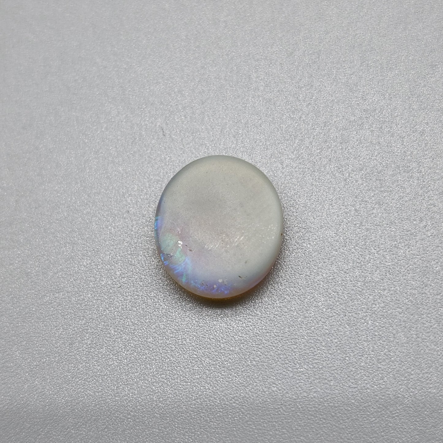 1.8cts Dark opal with blue green color play and blocky pattern with chaff