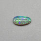 0.9ct freeform Dark Opal with aesthetic Green/blue pattern