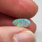 0.9ct freeform Dark Opal with aesthetic Green/blue pattern