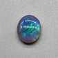 2.5ct Dark opal with a a dark blue base overlane by a minty green chaff pattern