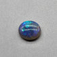 2.5ct Dark opal with a a dark blue base overlane by a minty green chaff pattern