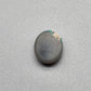 2.5ct Dark opal with a a dark blue base overlane by a minty green chaff pattern