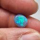 2.5ct Dark opal with a a dark blue base overlane by a minty green chaff pattern