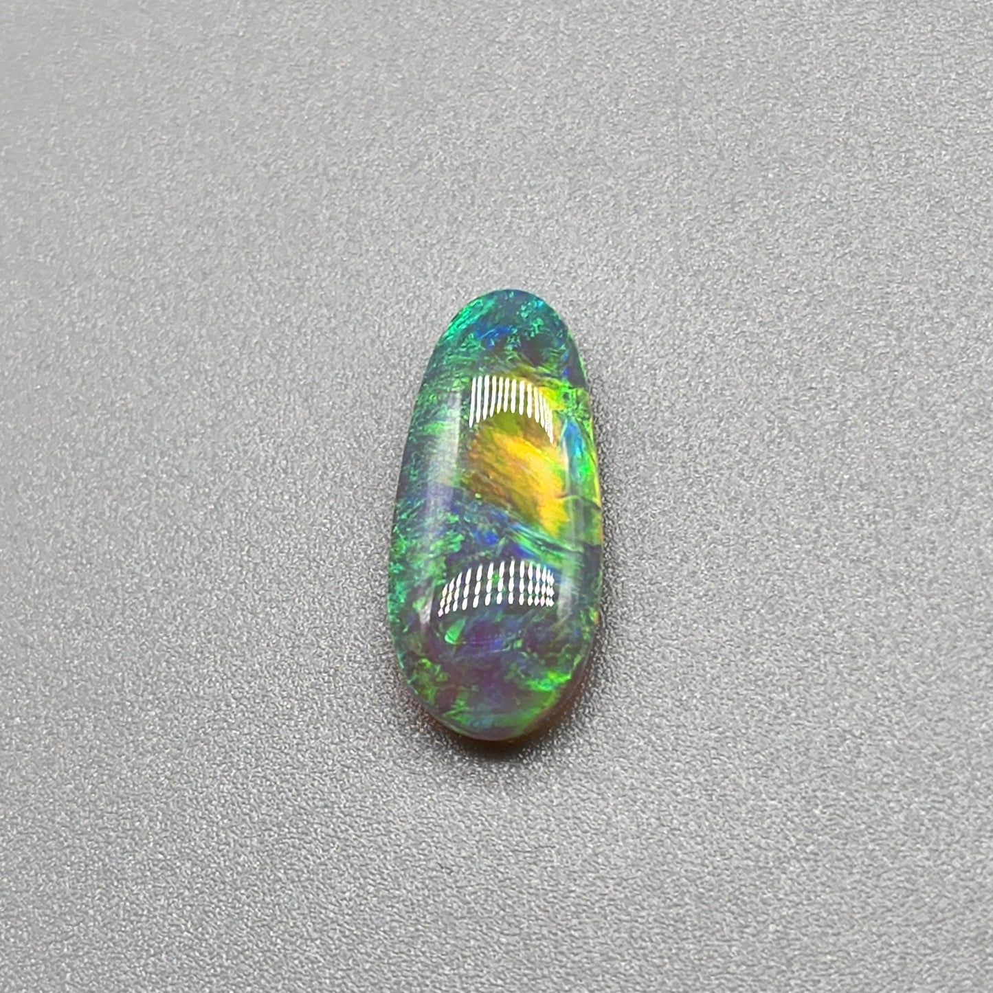 2.3ct Dark opal with gold-green color play and lovely pattern