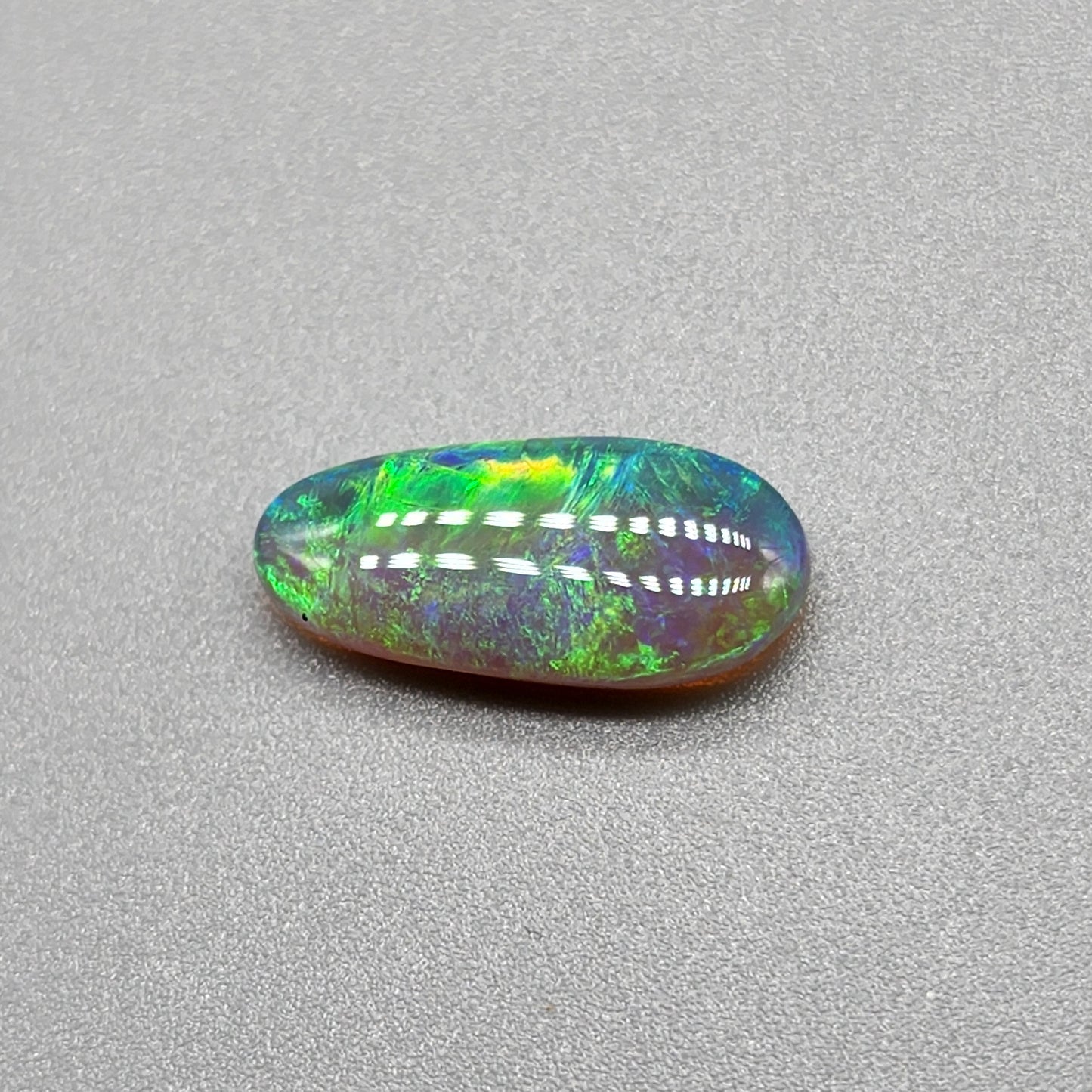 2.3ct Dark opal with gold-green color play and lovely pattern