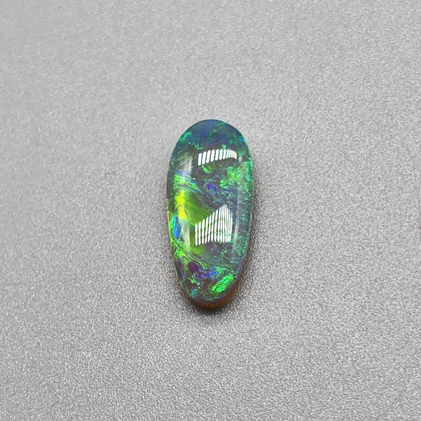 2.3ct Dark opal with gold-green color play and lovely pattern