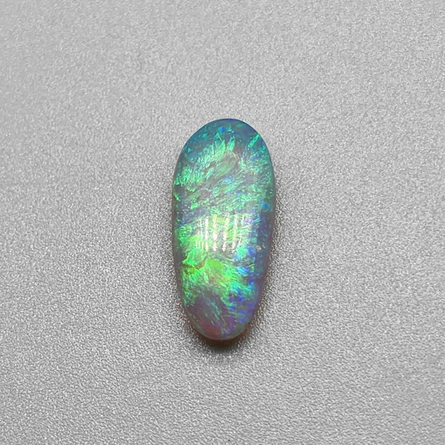 2.3ct Dark opal with gold-green color play and lovely pattern