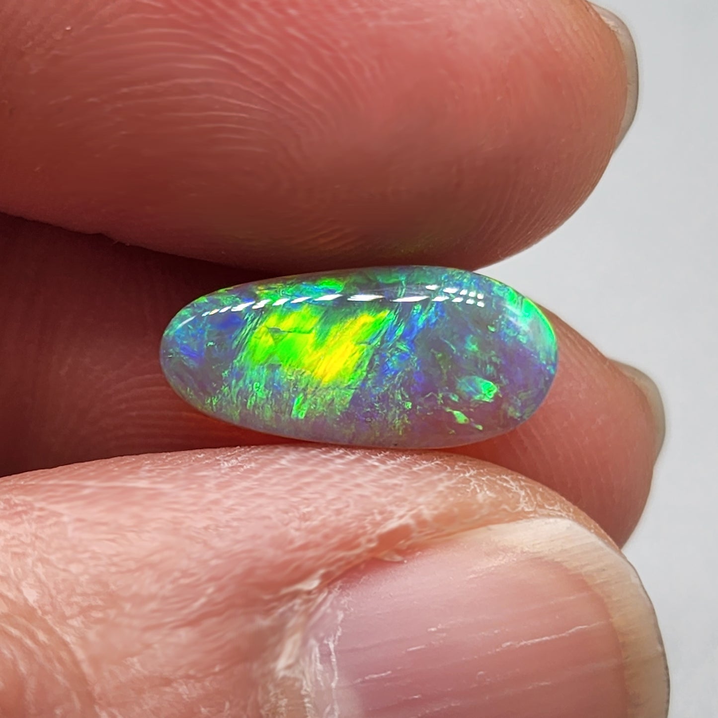 2.3ct Dark opal with gold-green color play and lovely pattern