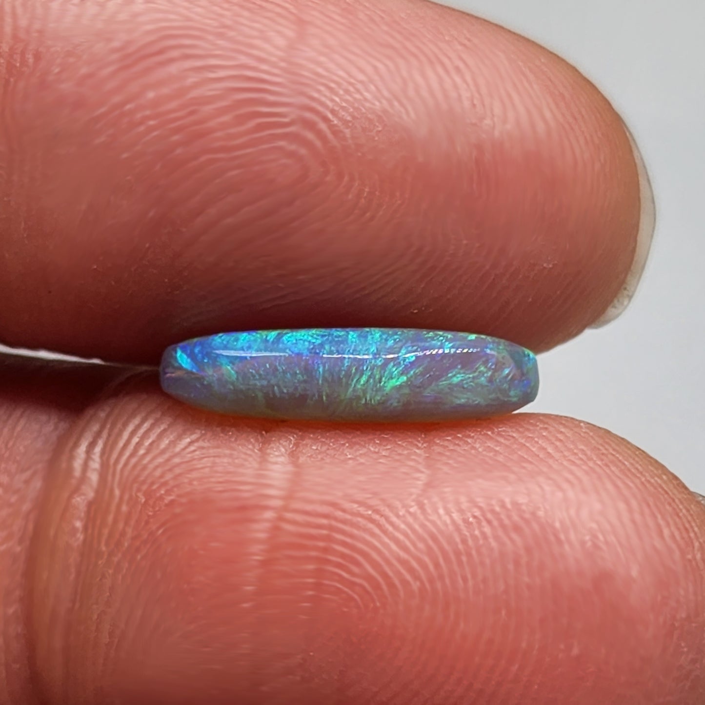 2.3ct Dark opal with gold-green color play and lovely pattern