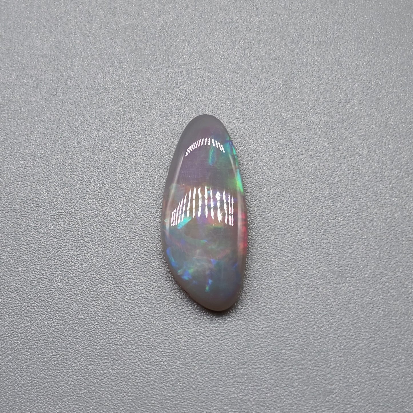 1.65cts  Dark opal with a pastel color pallet