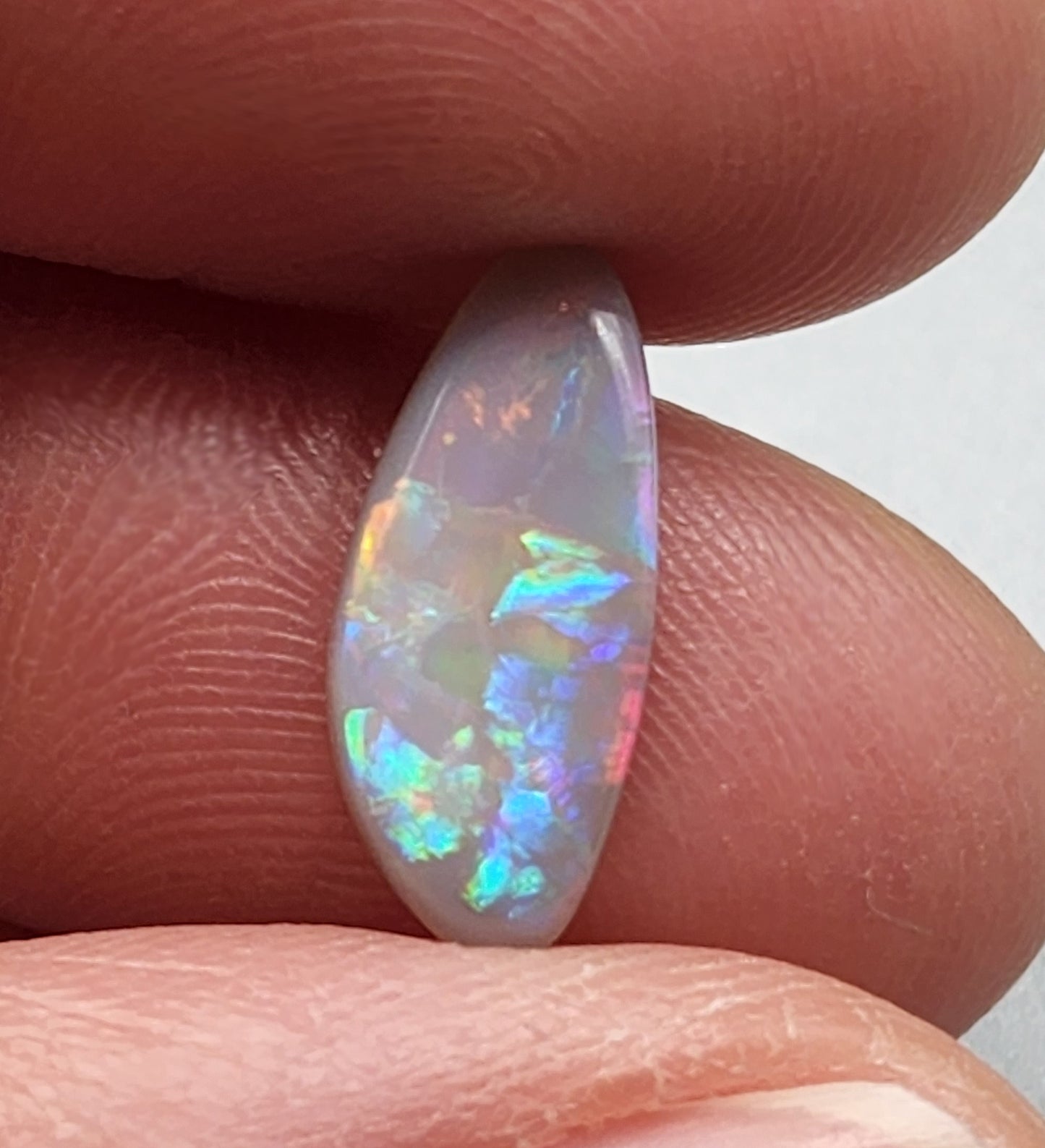 1.65cts  Dark opal with a pastel color pallet