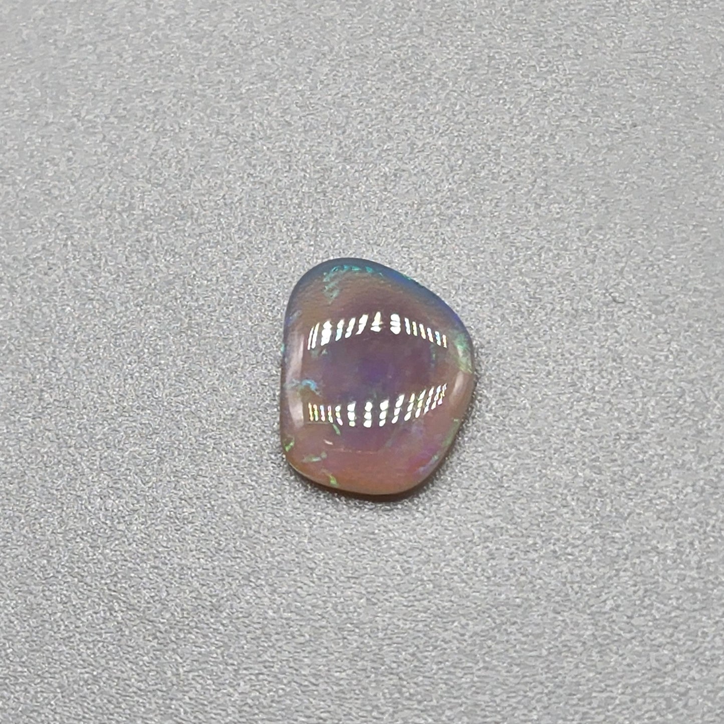 0.65cts Dark Crystal Opal with Green/blue broad flash