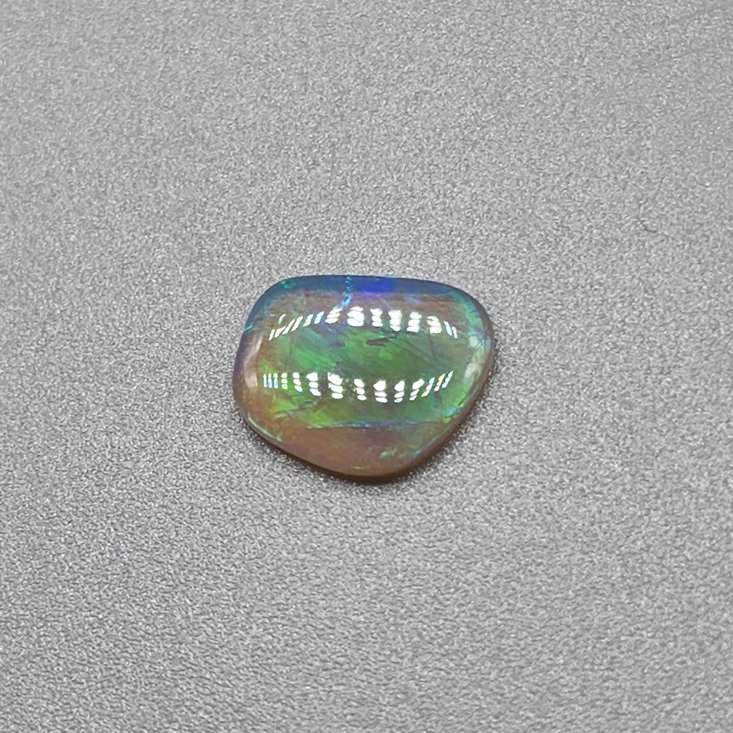 0.65cts Dark Crystal Opal with Green/blue broad flash