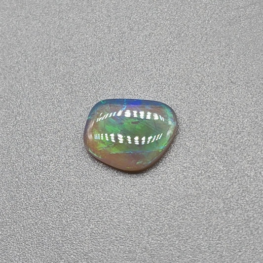 0.65cts Dark Crystal Opal with Green/blue broad flash