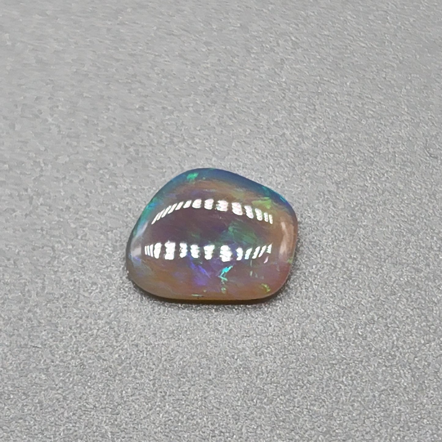 0.65cts Dark Crystal Opal with Green/blue broad flash