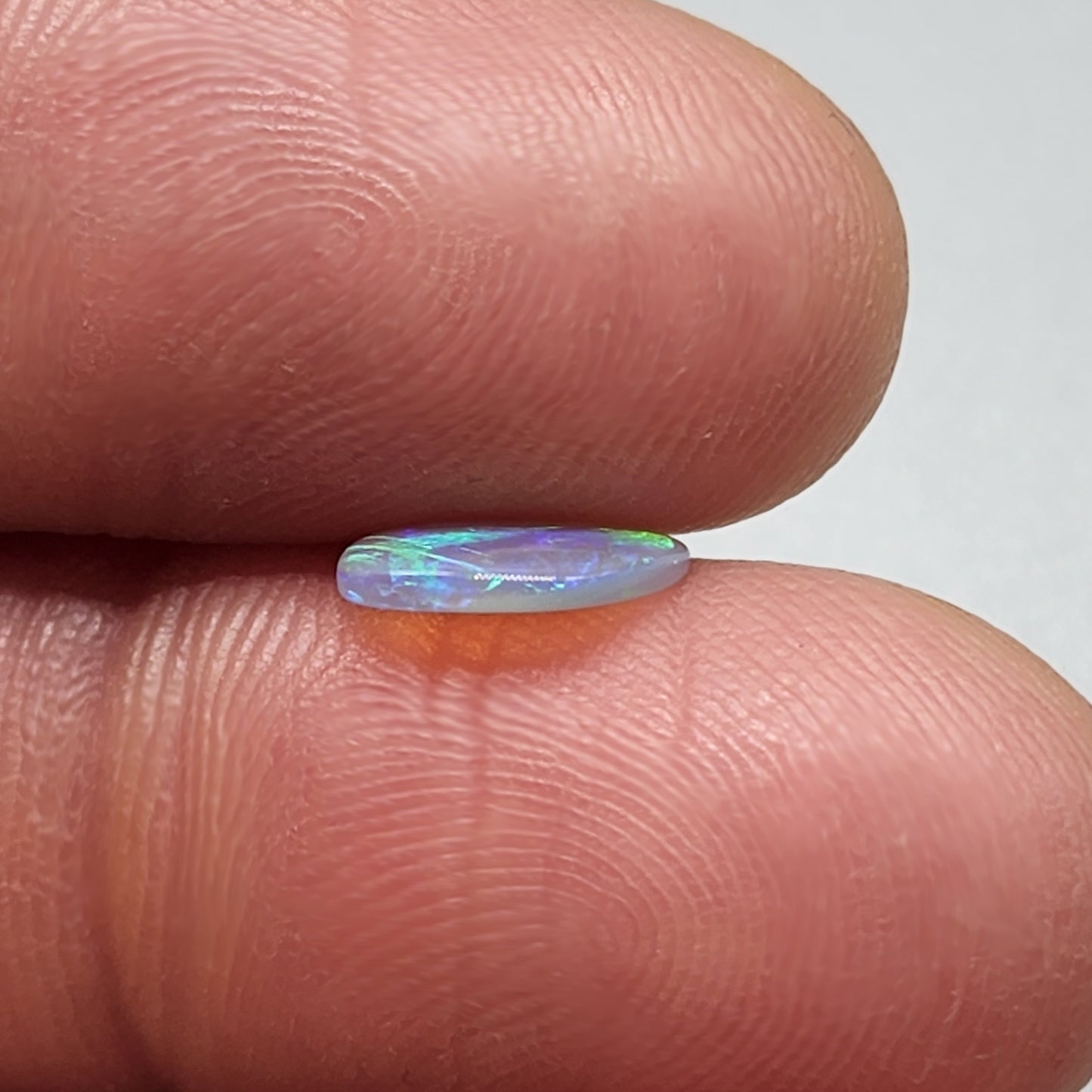 0.65cts Dark Crystal Opal with Green/blue broad flash