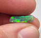 1.3cts Dark opal with elongated freeform shape and blue and green color play