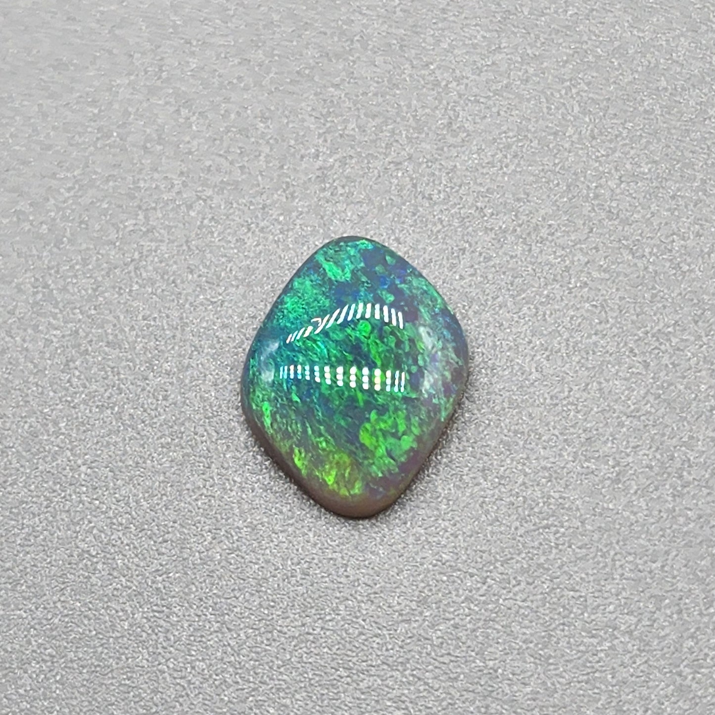 1.3cts Dark opal with Tealy color pallet and a classic mossy pattern