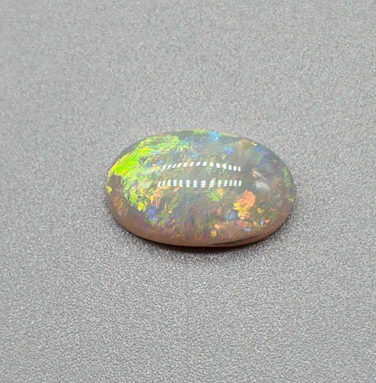 2.4cts dark opal with a yellow multicolor pallet and mixed patterns