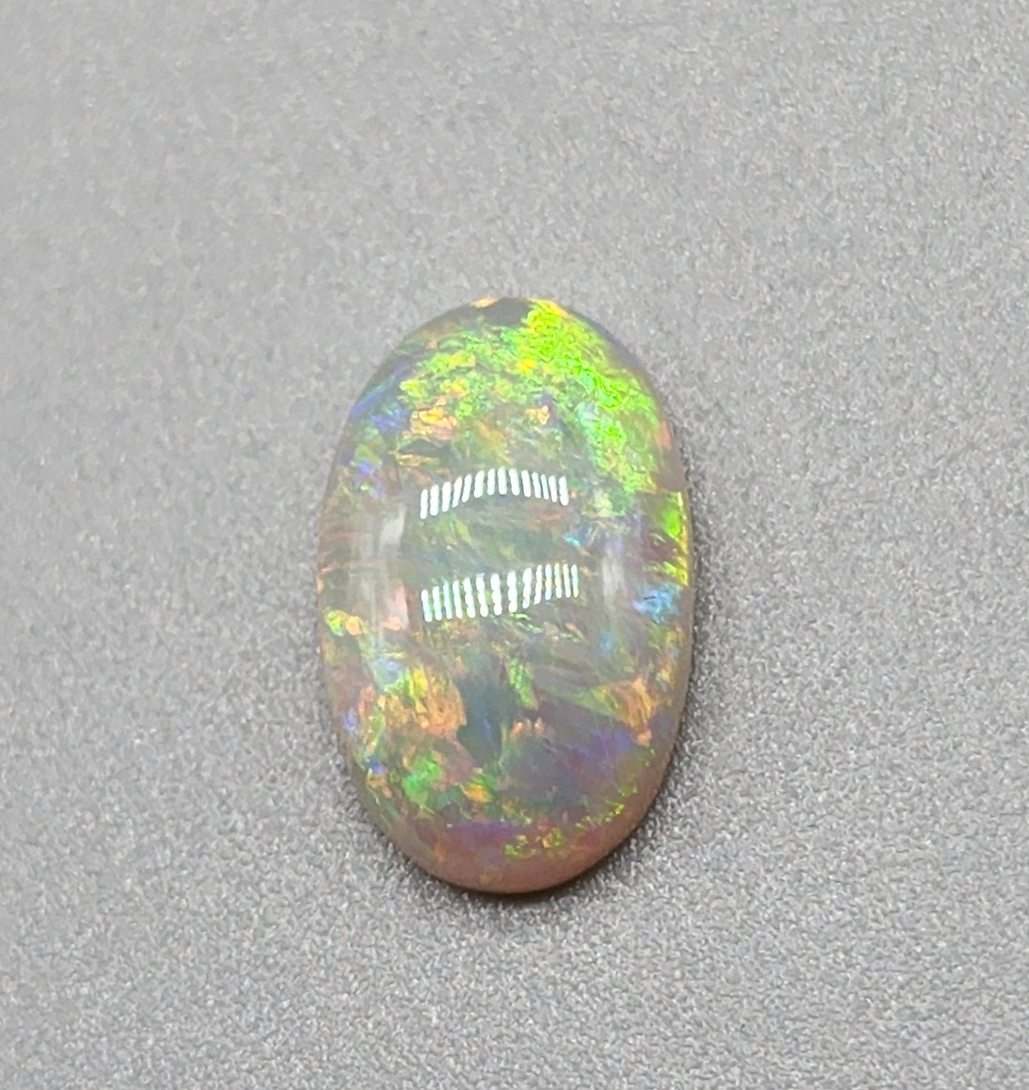 2.4cts dark opal with a yellow multicolor pallet and mixed patterns