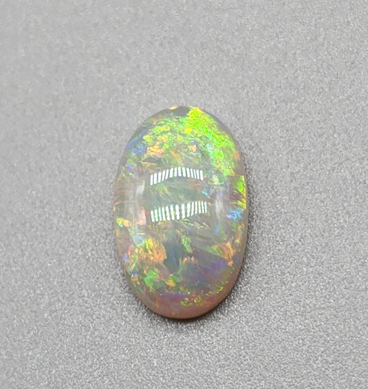 2.4cts dark opal with a yellow multicolor pallet and mixed patterns