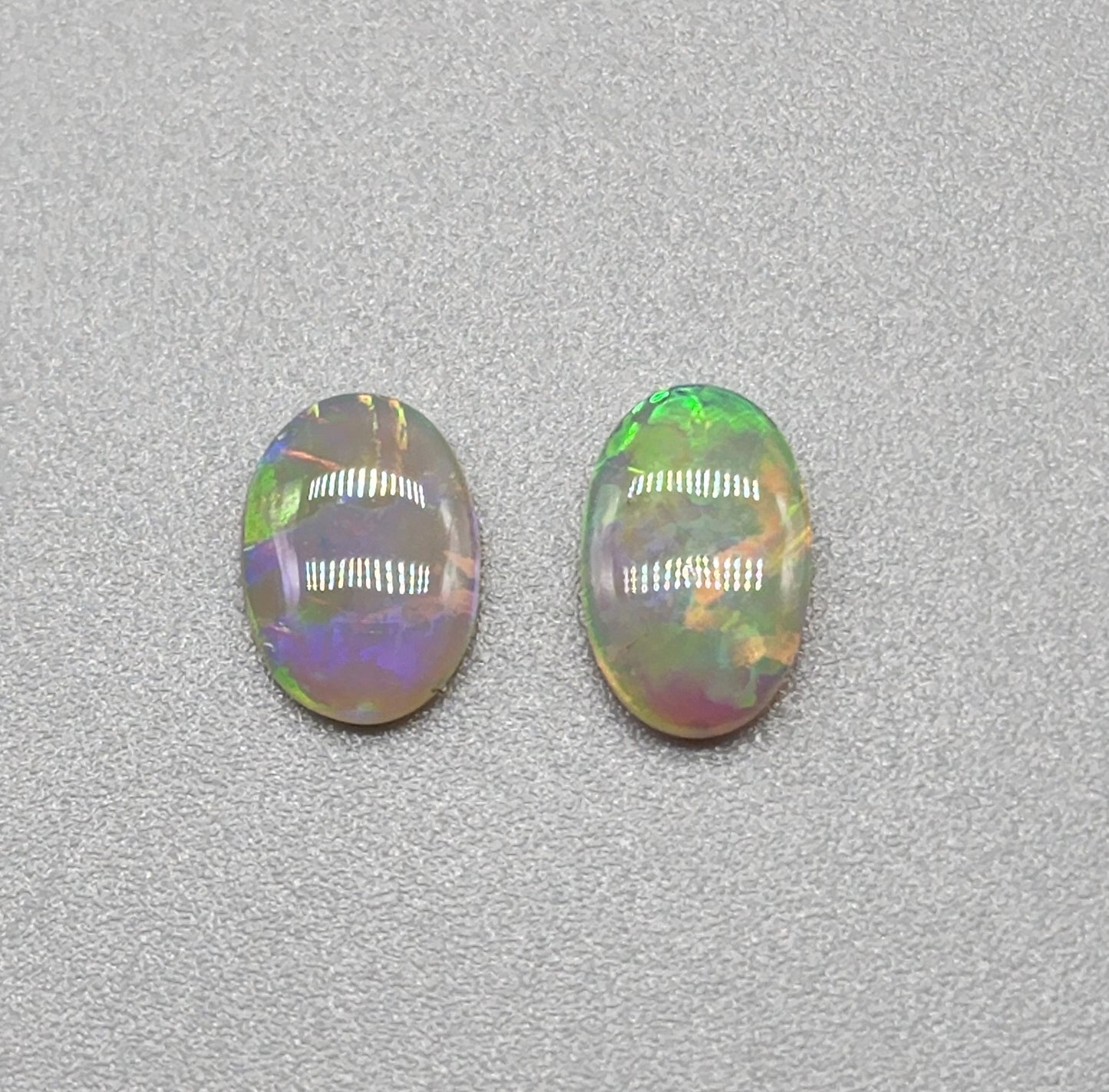 1ct Mismatched pair Dark opal with greens, oranges and light blues