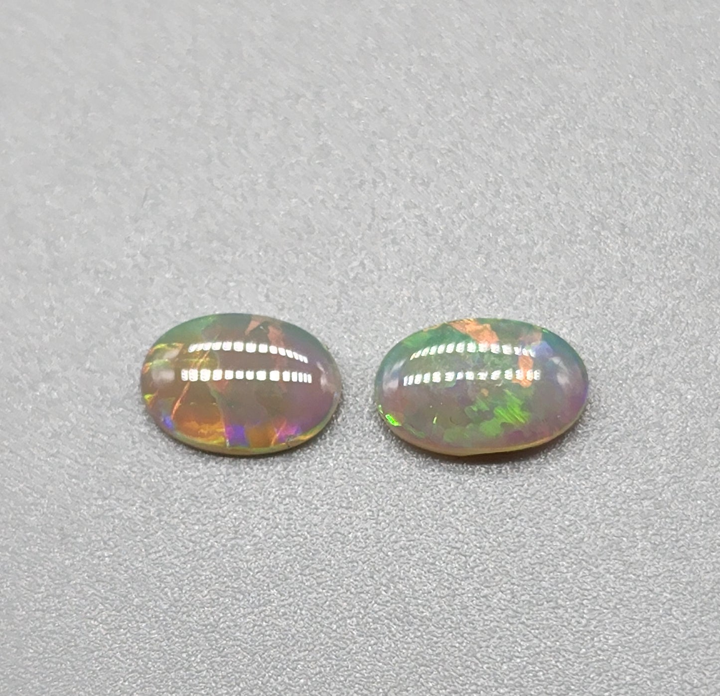 1ct Mismatched pair Dark opal with greens, oranges and light blues