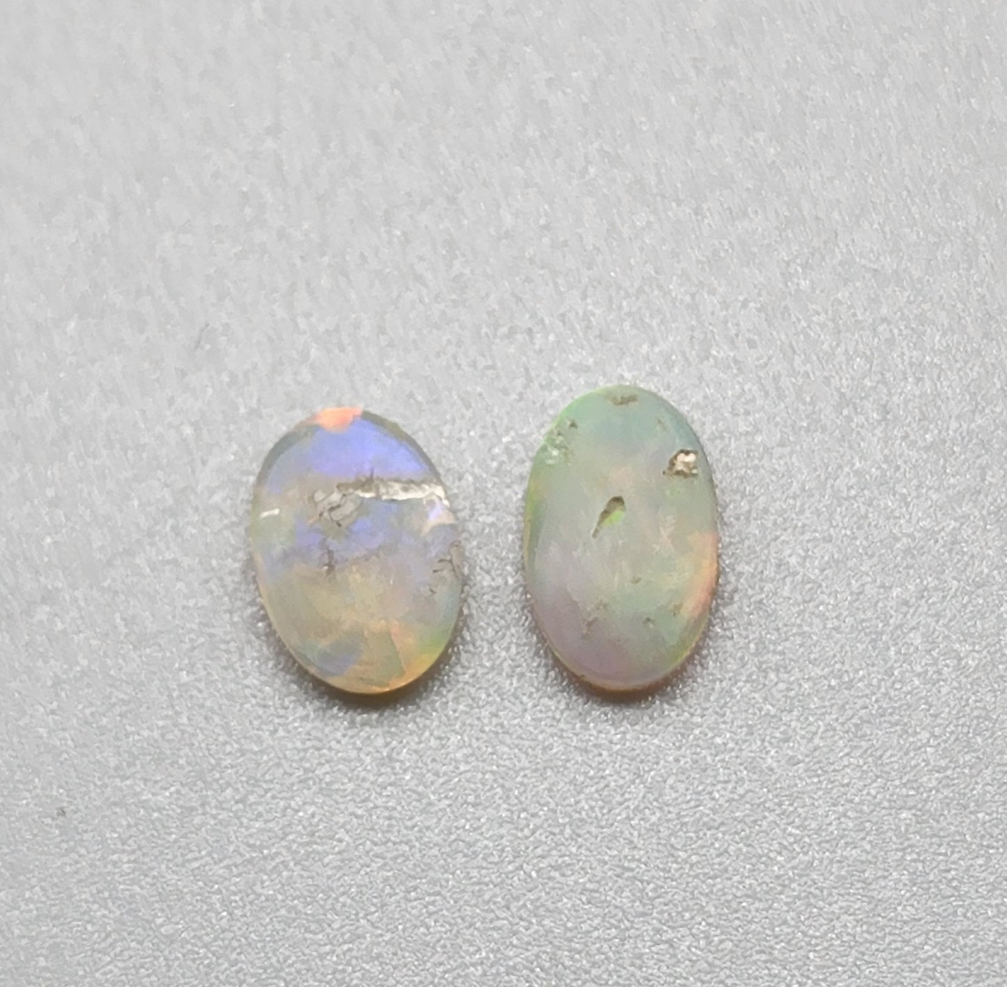 1ct Mismatched pair Dark opal with greens, oranges and light blues