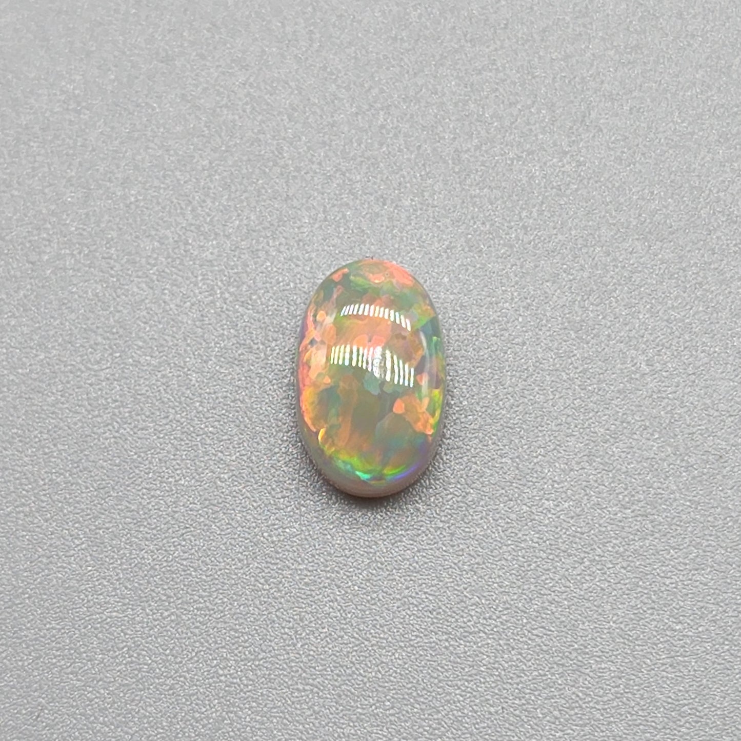 1.4ct with a pastel multi color pallet, and an incredible, full faced floral pattern.