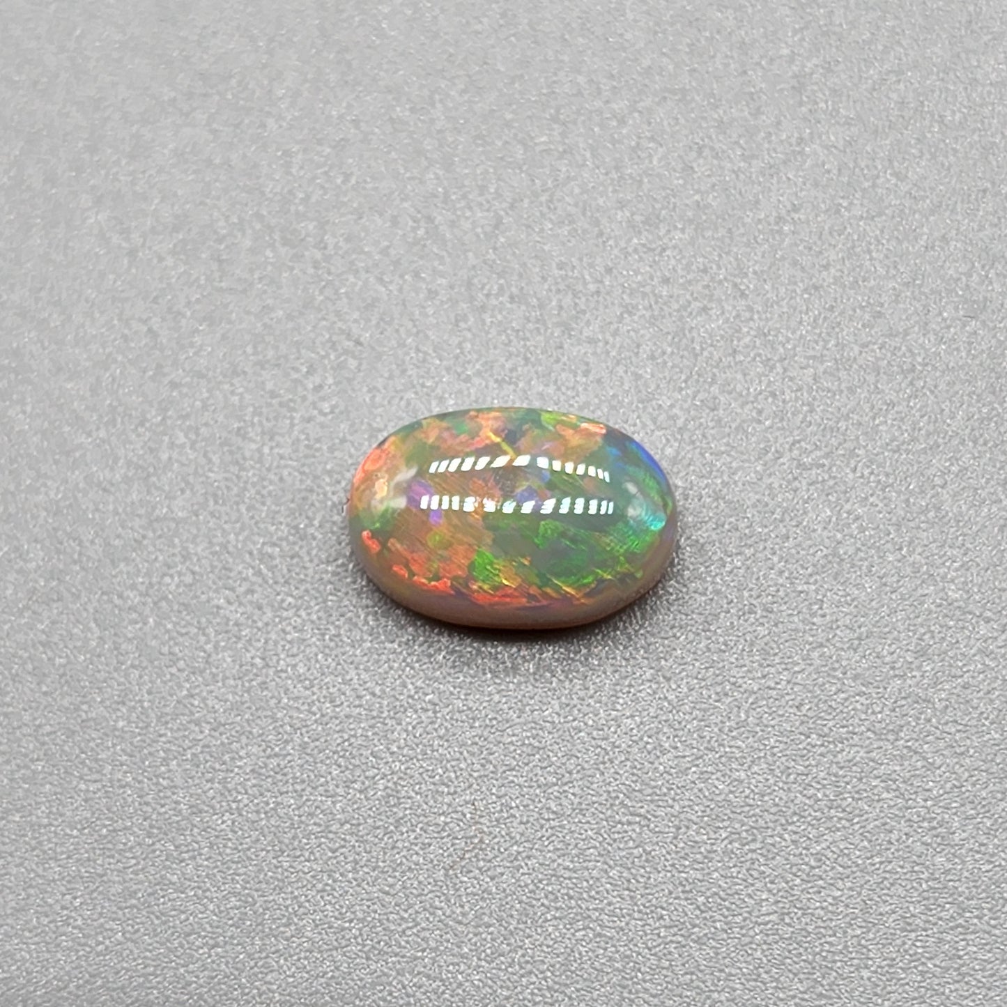 1.4ct with a pastel multi color pallet, and an incredible, full faced floral pattern.