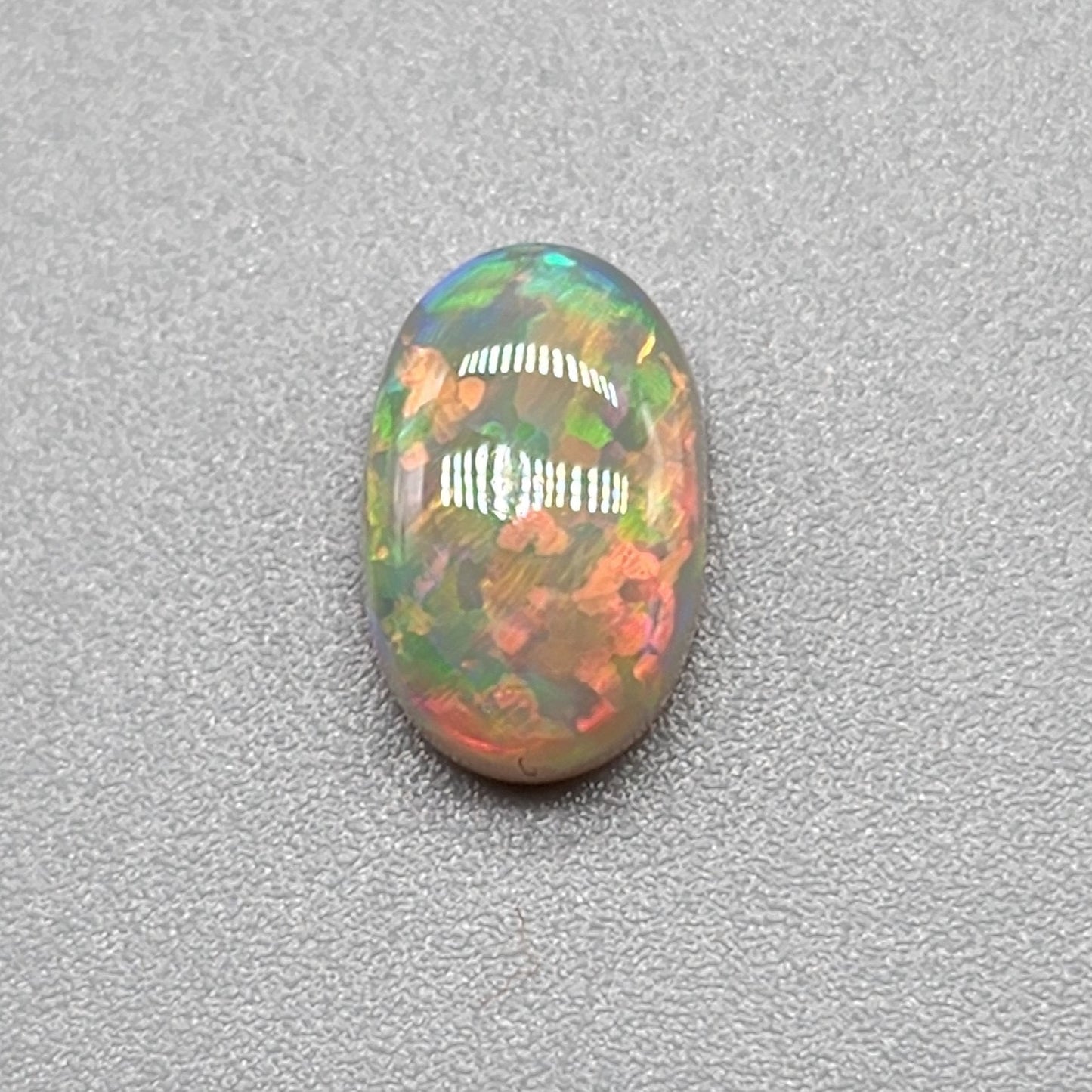 1.4ct with a pastel multi color pallet, and an incredible, full faced floral pattern.