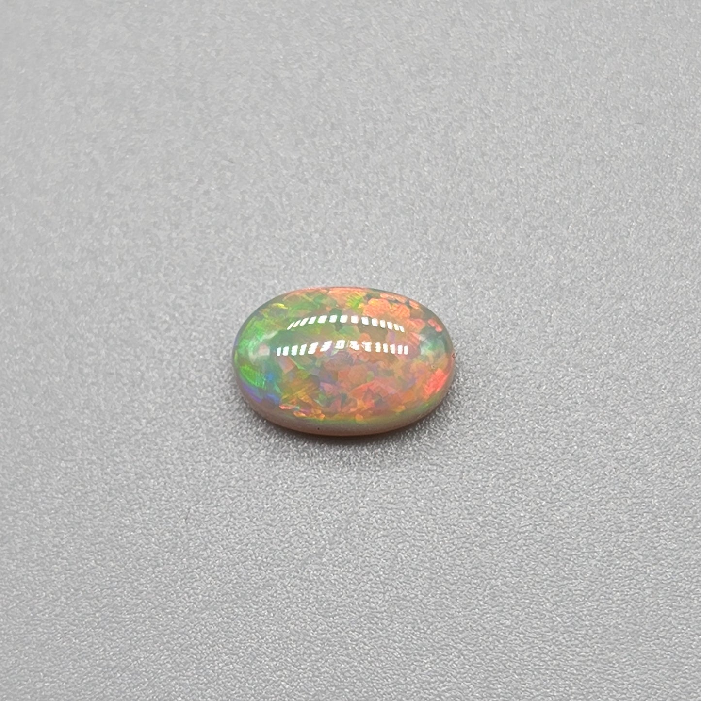 1.4ct with a pastel multi color pallet, and an incredible, full faced floral pattern.