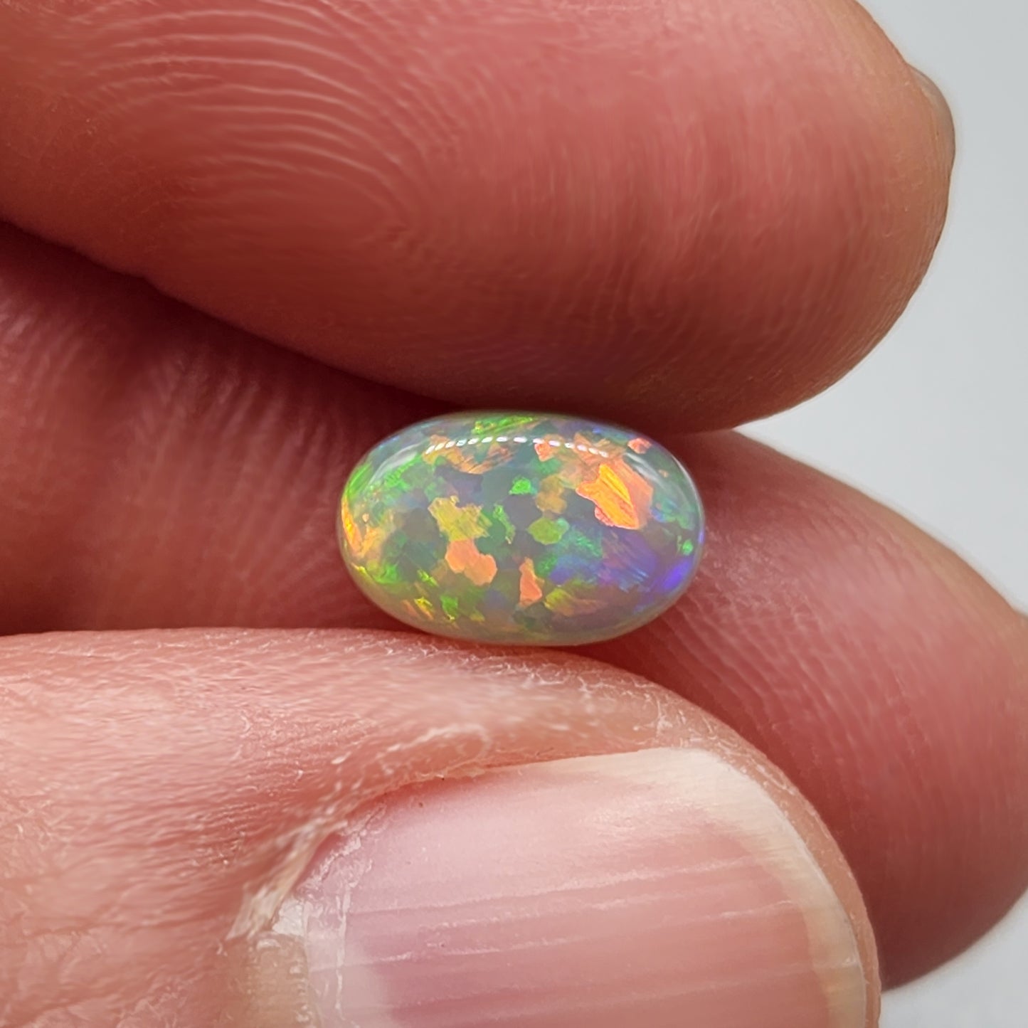 1.4ct with a pastel multi color pallet, and an incredible, full faced floral pattern.