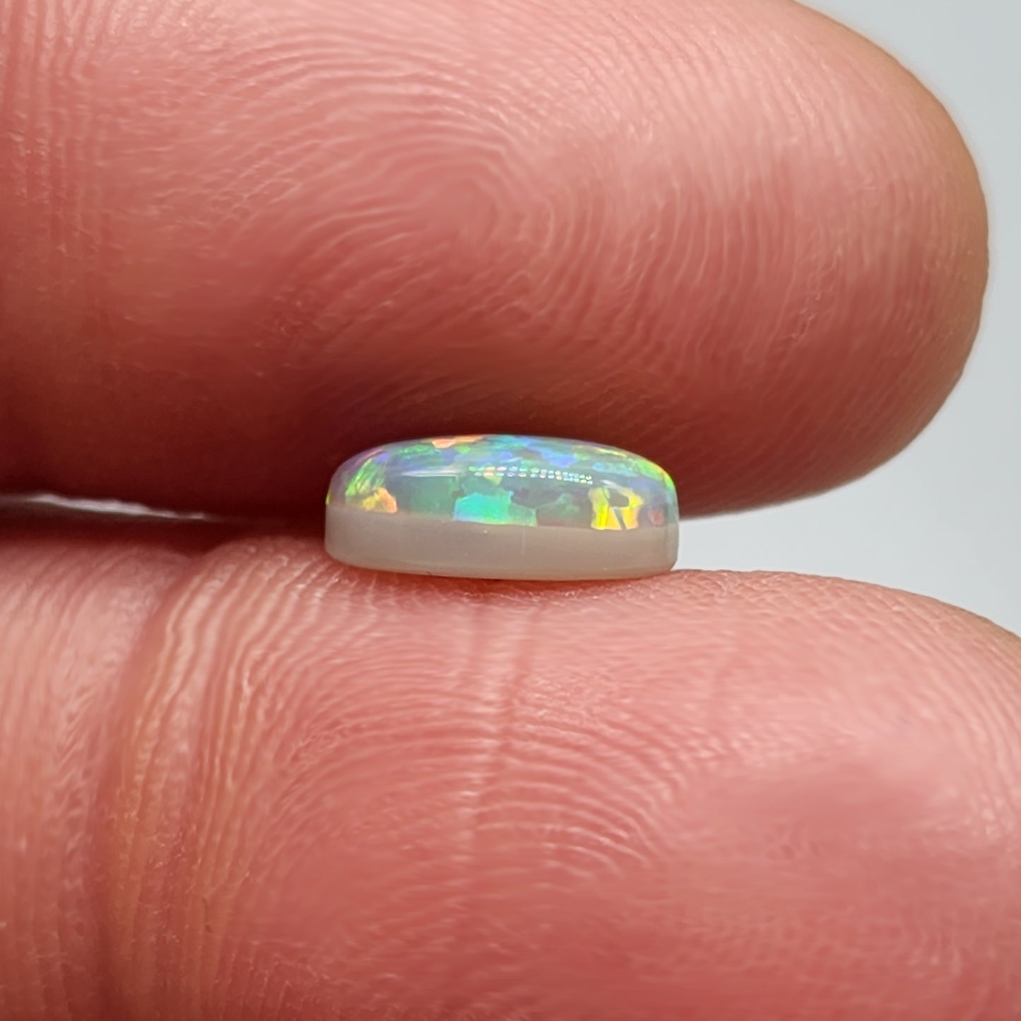 1.4ct with a pastel multi color pallet, and an incredible, full faced floral pattern.