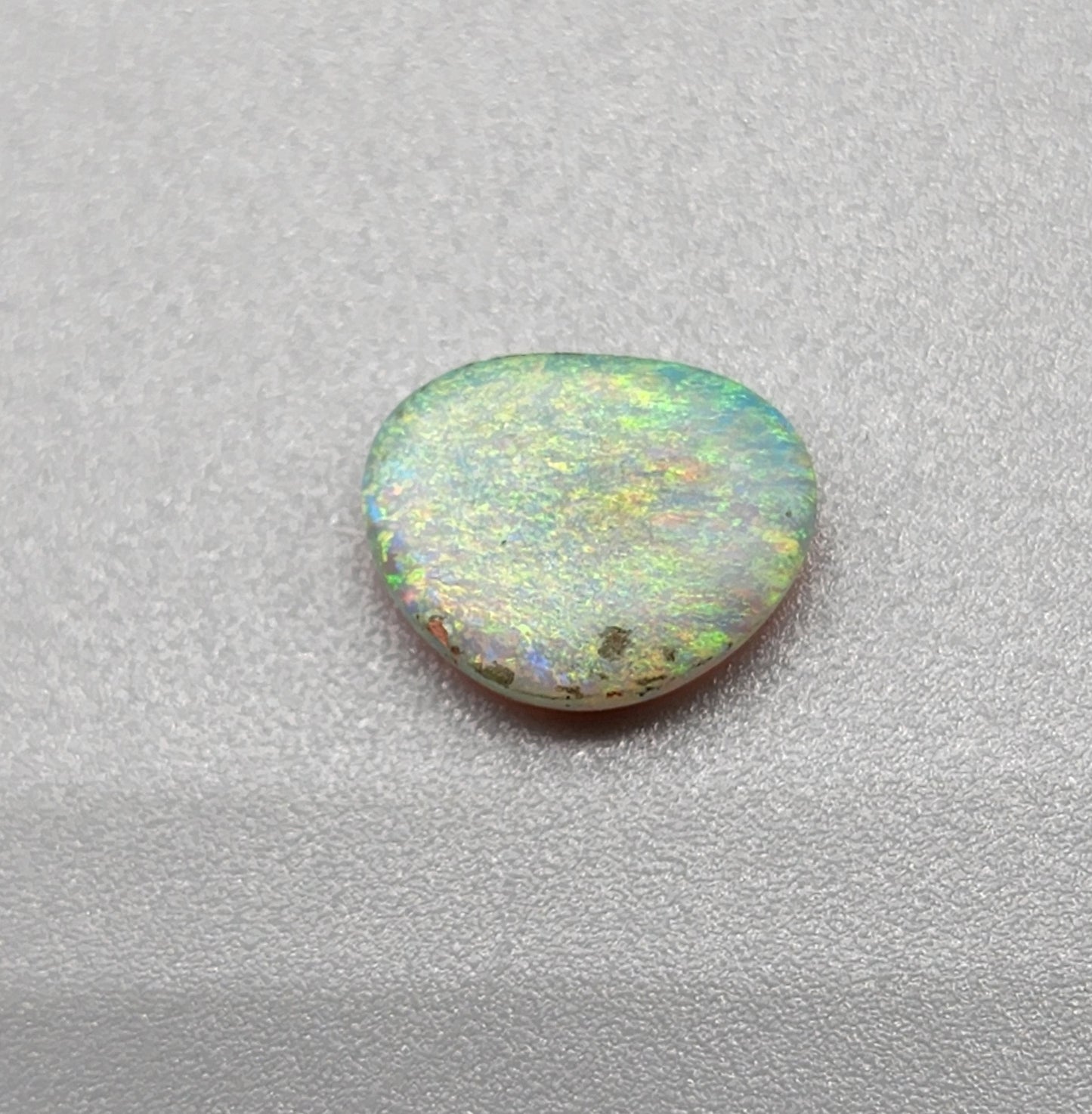 1.2cts Dark opal with a multi color pallet and feathery small flash pattern