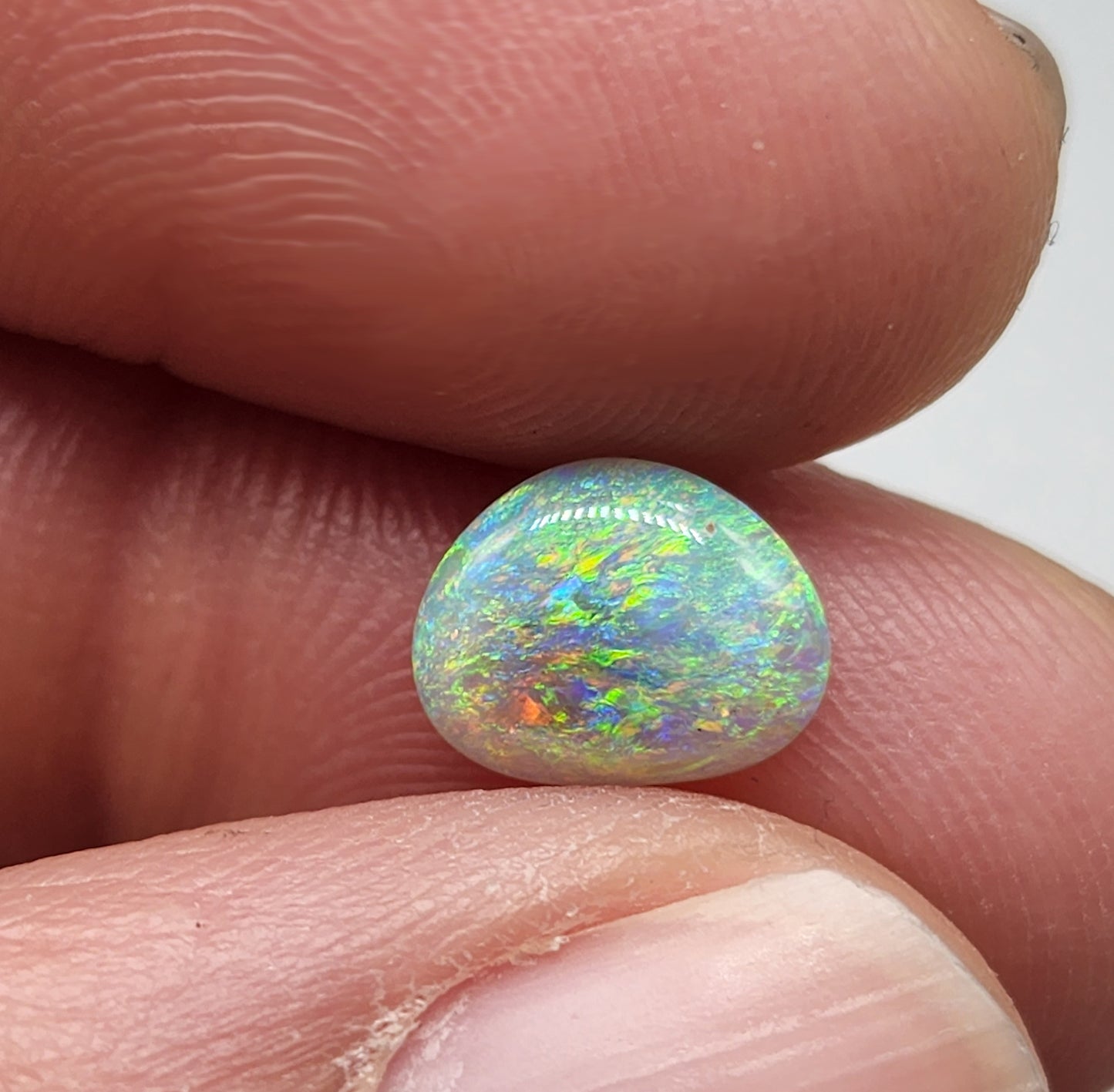 1.2cts Dark opal with a multi color pallet and feathery small flash pattern